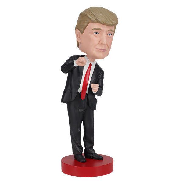 Trump Dance Bobblehead displaying Donald Trump in a suit with a playful dance pose, highlighting vibrant details for political humor lovers.