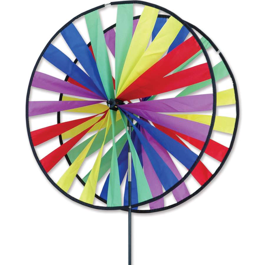 24-inch Twin Wheel Spinner with large, colorful, counter-spinning wheels creating a kaleidoscope effect in an outdoor garden setting.