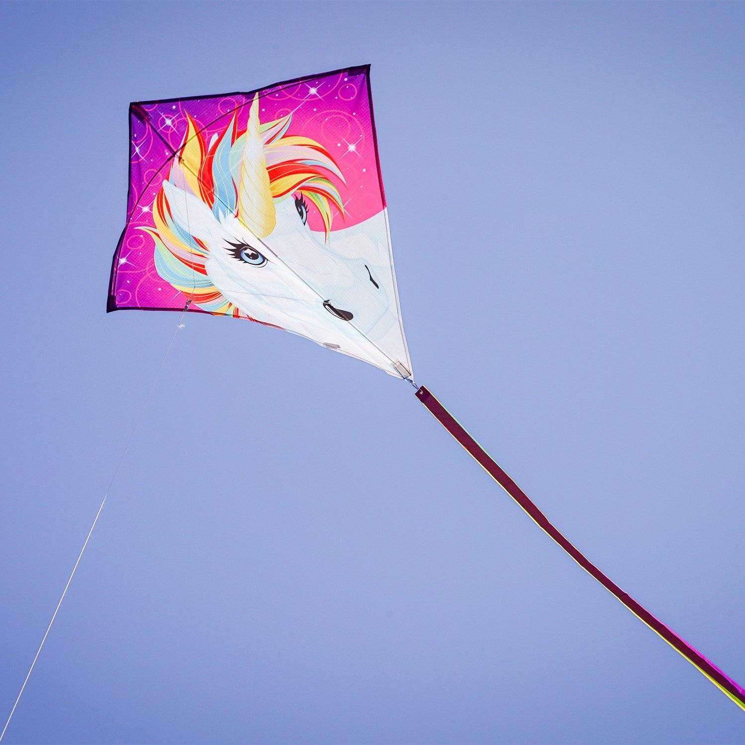 The Unicorn 30" Diamond Kite features a stunning and colorful unicorn design, made from weather-resistant ripstop fabric, perfect for outdoor flying adventures.