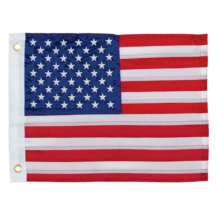 US Flag Embroidered 12x18 Grommet Flag with quality embroidered stars and durable fabric displayed gracefully on an outdoor flagpole.