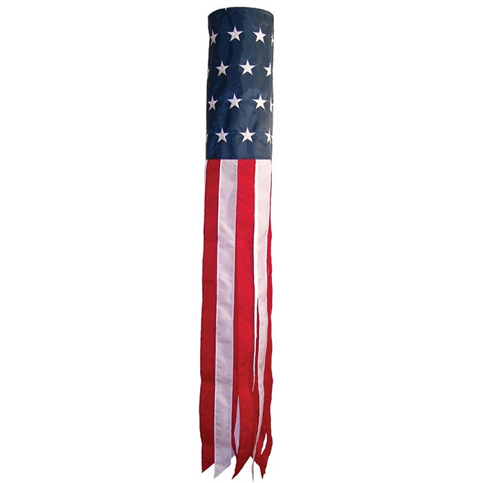 U.S. Stars and Stripes 60-inch windsock with embroidered stars and colorful tails displayed outside in a garden setting.