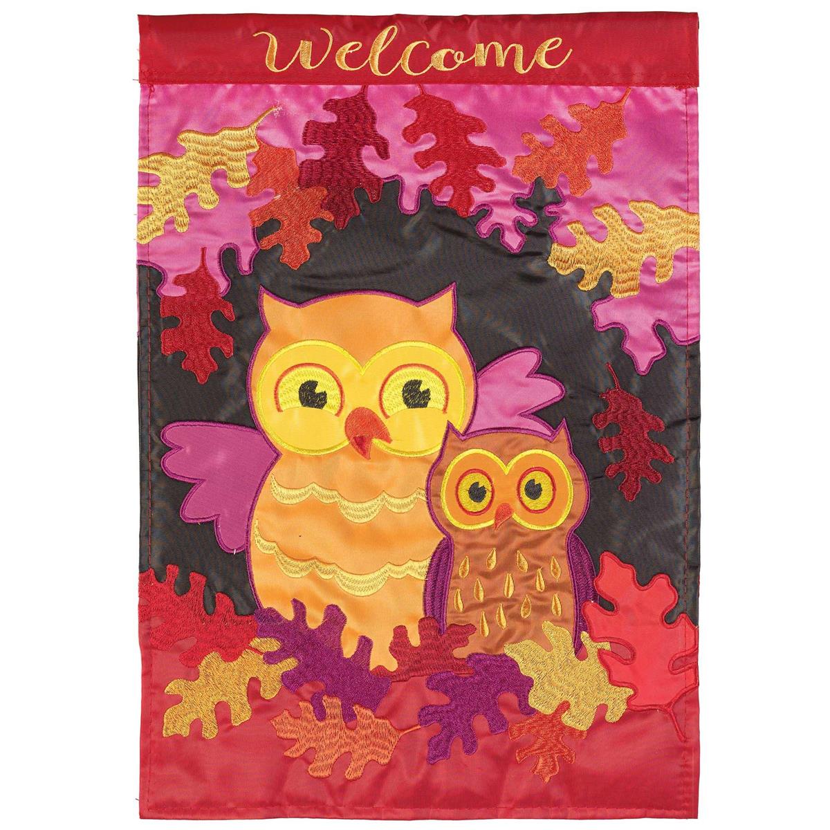 Welcome Fall Owls garden flag featuring colorful owl designs, beautifully embroidered on both sides, displayed in a garden setting during autumn.