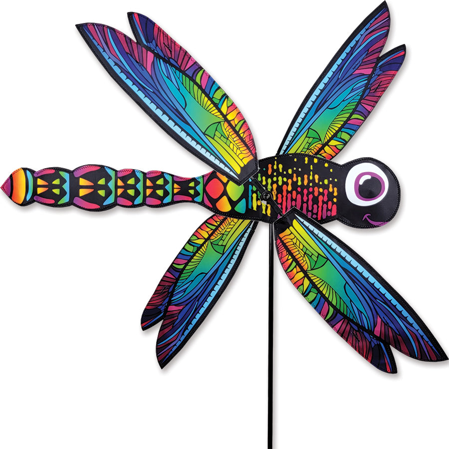 WhirliGig Spinner - Dragonfly made of durable SunTex fabric, displaying vibrant colors as it spins in a gentle breeze among garden flowers.