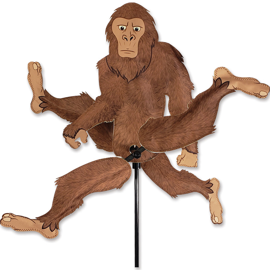 WhirliGig Spinner - Bigfoot featuring animated Bigfoot design, spinning in the breeze outdoors, adding charm to a garden setting.