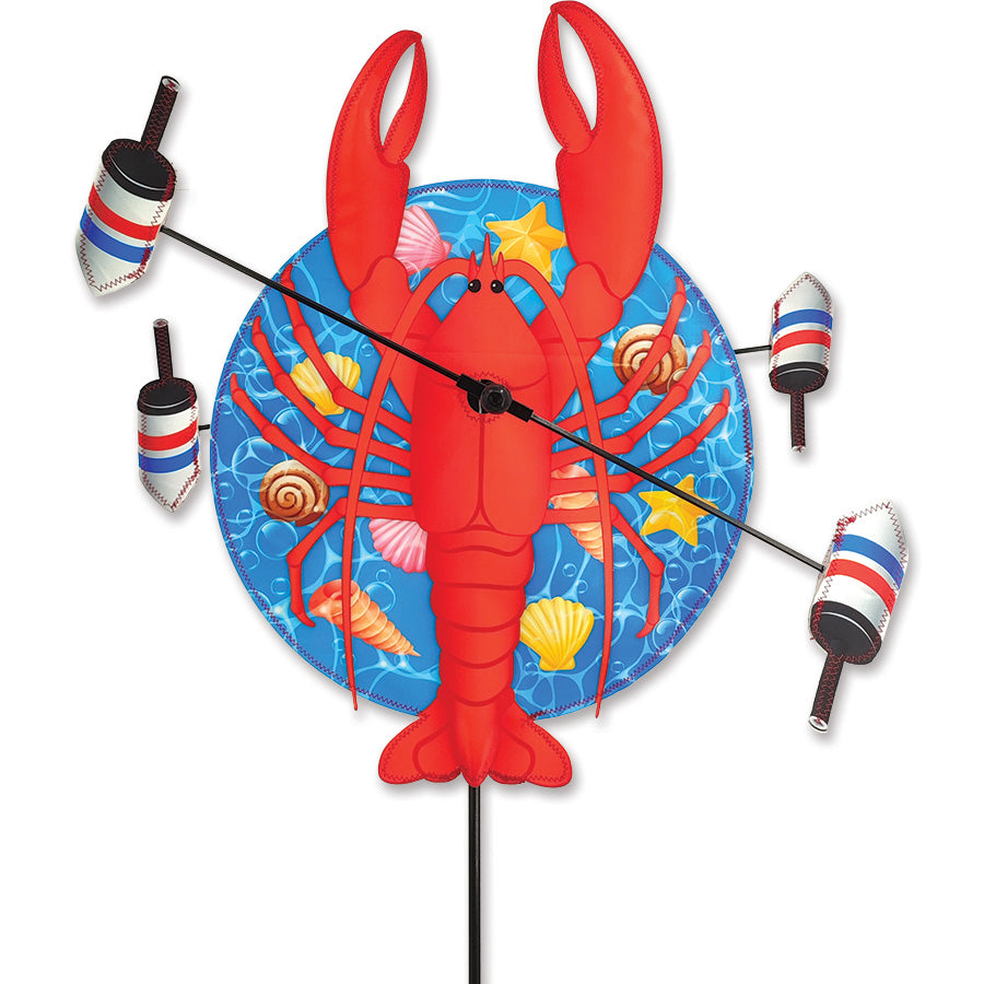WhirliGig Spinner in Lobster theme displaying colorful buoys, spinning in light winds in a garden setting.