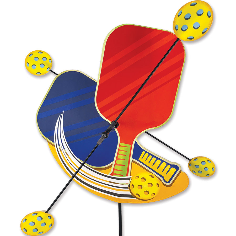 WhirliGig Spinner featuring colorful pickleballs, spinning gracefully in an outdoor garden setting, providing an eye-catching decoration.