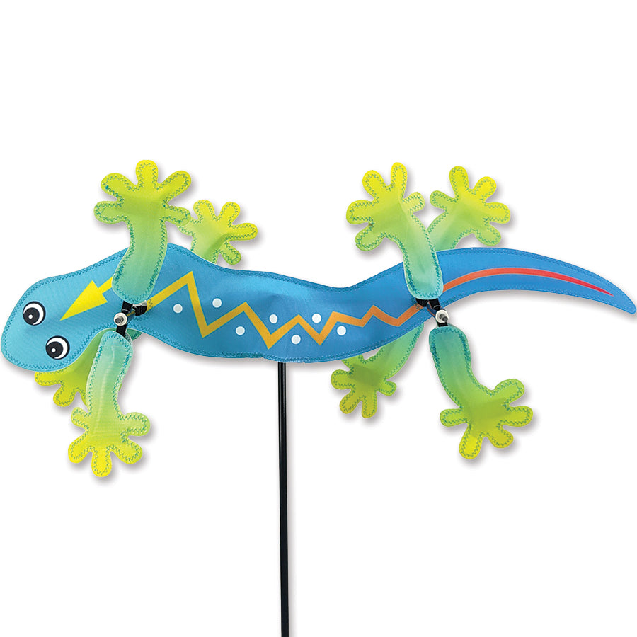 WhirliGig Spinner - Southwestern Gecko elegantly spinning in the wind, showcasing vibrant colors and playful design in a garden setting.