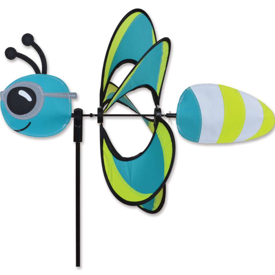 Whirly Wing Spinner in Reflective Firefly design with glowing wing borders and sunglasses, displayed in a garden setting at night.