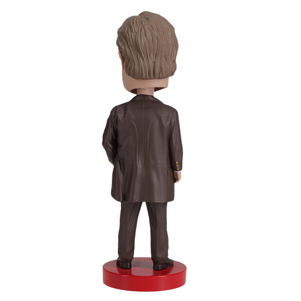 William Howard Taft bobblehead, an 8-inch collectible made from heavyweight polyresin, showcasing Taft's likeness with hand-painted details.