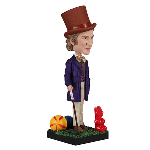 Willy Wonka Bobblehead featuring a whimsical character with a top hat and purple suit, beautifully displayed on a shelf.
