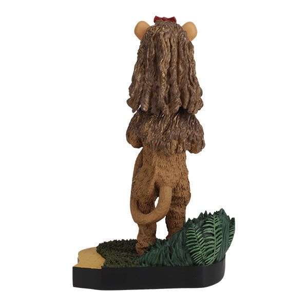 Wizard of Oz Cowardly Lion Bobblehead on a yellow brick road base, showcasing intricate details and vibrant colors, perfect for collectors.