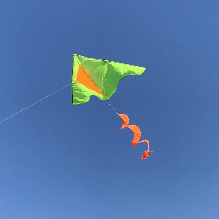 Yellow Colorblock Delta Kite featuring an orange twister tail against a clear blue sky, demonstrating ease of flight and eye-catching design.