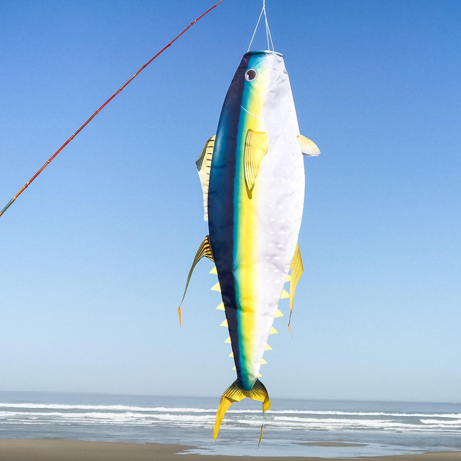 Yellowfin Tuna 48-inch fish windsock featuring realistic design, showcasing vibrant colors, displayed at a marina to celebrate ocean life.