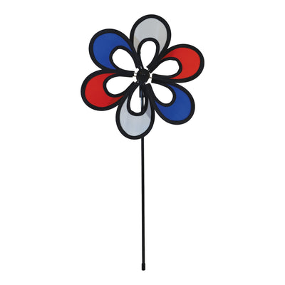 10-inch Red, White and Blue Windee Wheelz Spinner spinning in the garden, featuring an open-center petal design with vibrant colors.