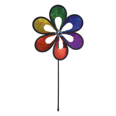 10-inch Rainbow Mylar Windee Wheelz Spinner with colorful petals, spinning atop a 17-inch fiberglass pole in a garden setting.