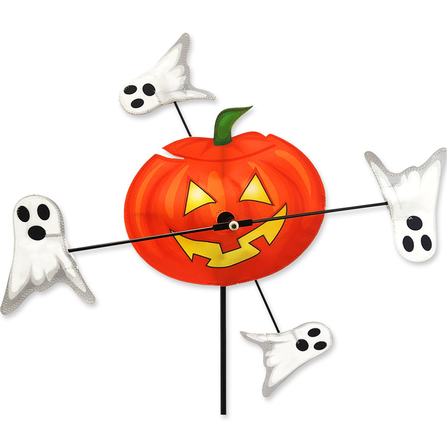 10 in. WhirliGig Spinner - Pumpkin featuring colorful pumpkin-shaped wings spinning gently in a garden setting under a sunny sky.