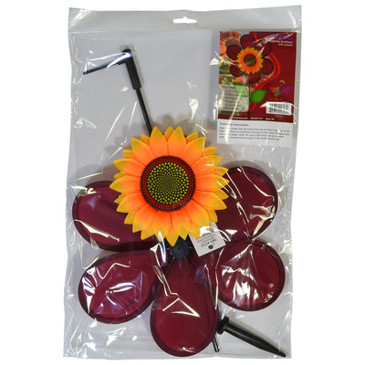 12" burgundy sunflower spinner in vibrant colors with spinning petals displayed in a garden setting, enhancing outdoor decor.