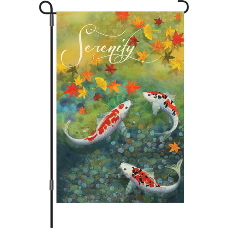 12 in. Autumn Pond garden flag displaying serene autumn colors and water imagery, fluttering in a garden setting on a flag stand.