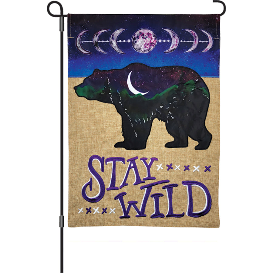 12 in. Burlap Flag - Stay Wild features an embroidered applique design displayed in a garden setting, emphasizing nature and adventure.