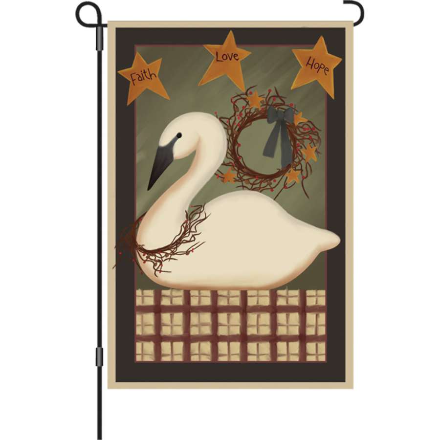12 in. garden flag featuring a stunning Country Swan design, beautifully displayed in a winter garden setting.