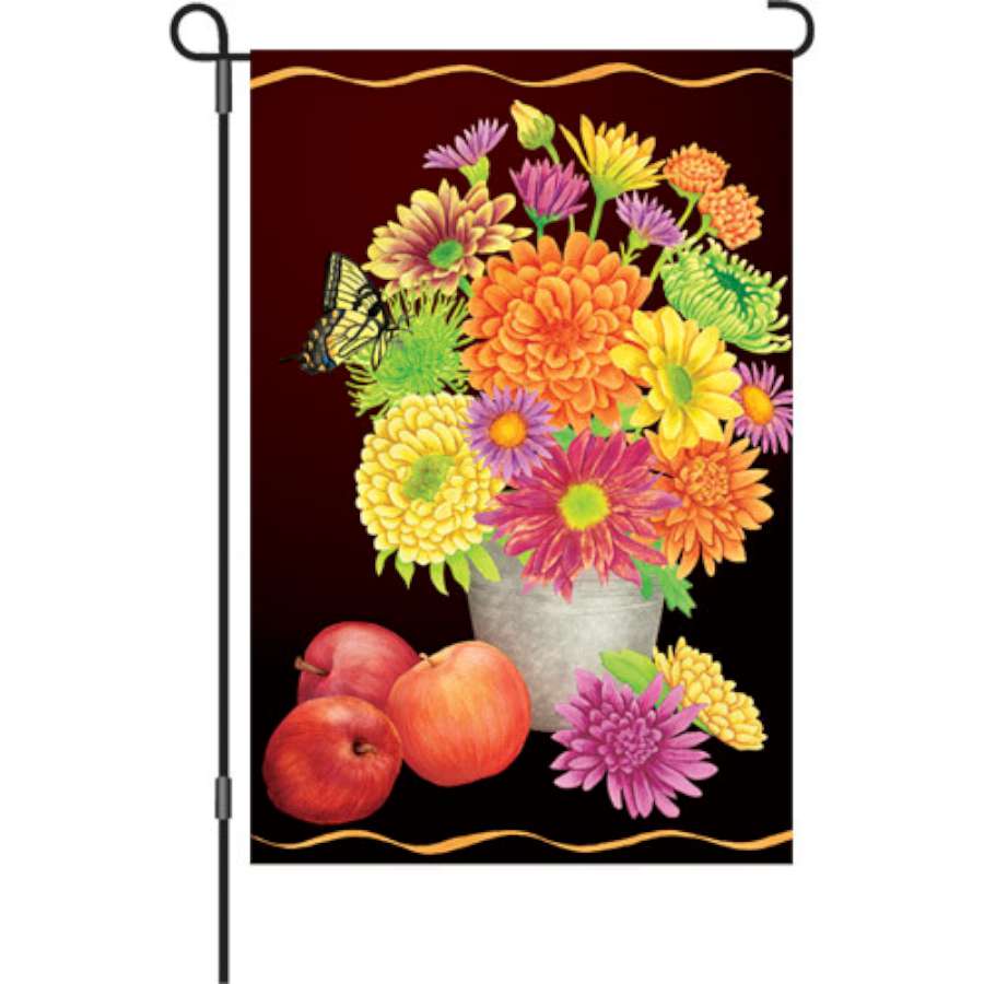 12 in. Fall Floral Flag featuring vibrant autumn flowers displayed outdoors, bringing warmth and seasonal charm to a garden setting.