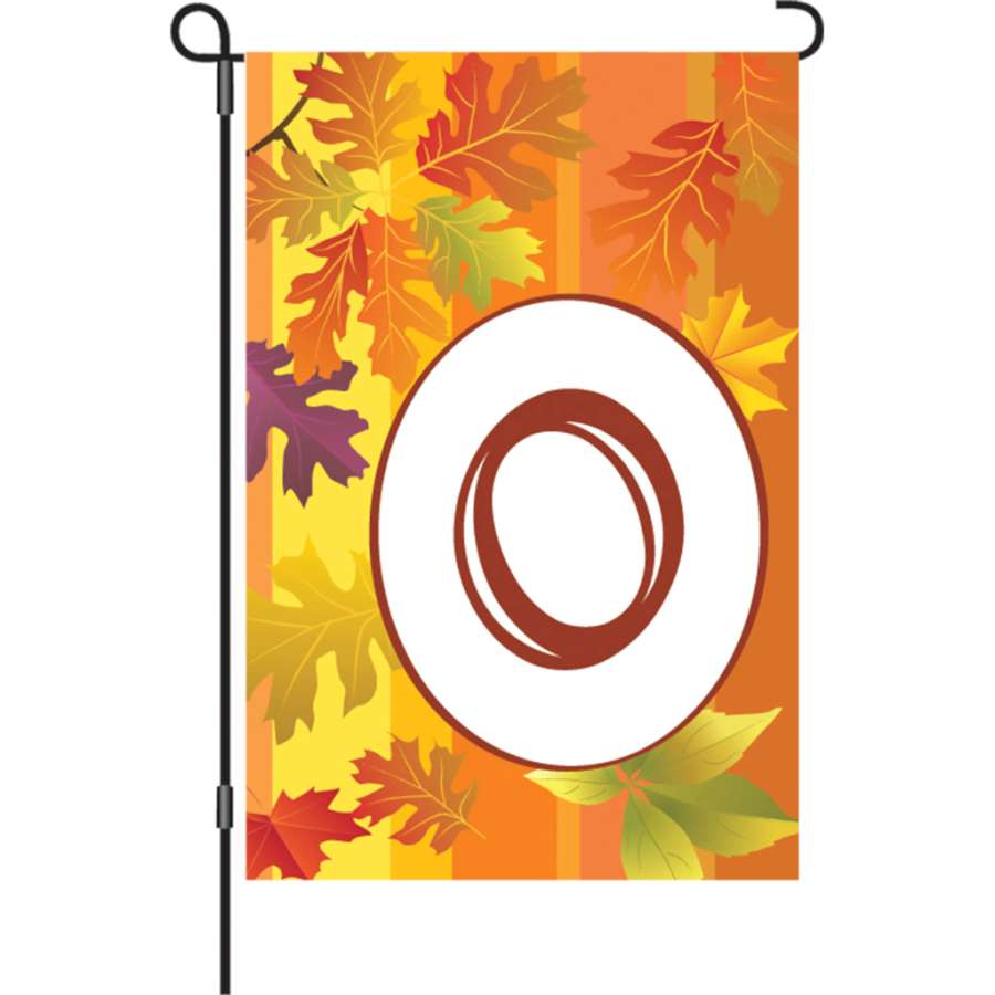 12 in. Fall Monogram Flag - O displayed outdoors, showcasing a vibrant autumn design and monogram letter on a garden flag stand.
