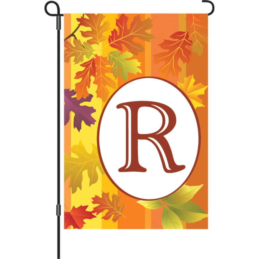 12 in. Fall Monogram Flag featuring the letter 'R' displayed in a garden setting, showcasing vibrant colors and top-stitching for durability.