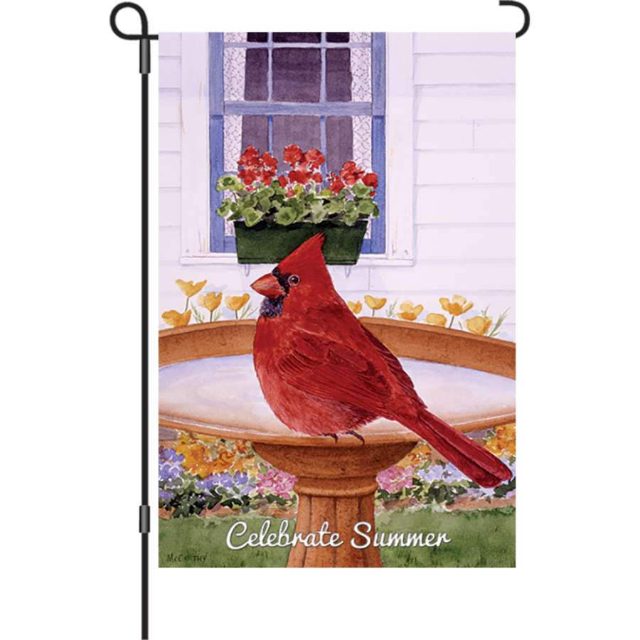 12 in. Flag - Cardinal and Geraniums displayed outdoors, featuring a vibrant cardinal and lush geraniums on a lightweight fabric.