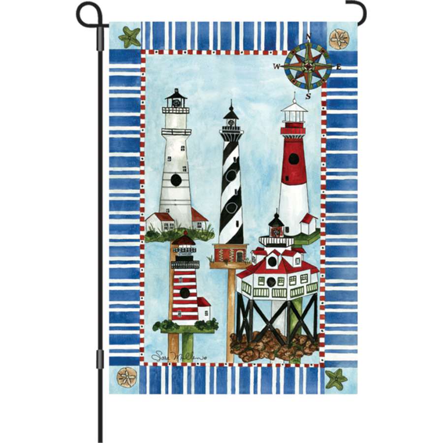 12 in. Flag - Eastern Lights with vibrant colors displayed in a garden, illuminated to create a cheerful atmosphere at twilight.