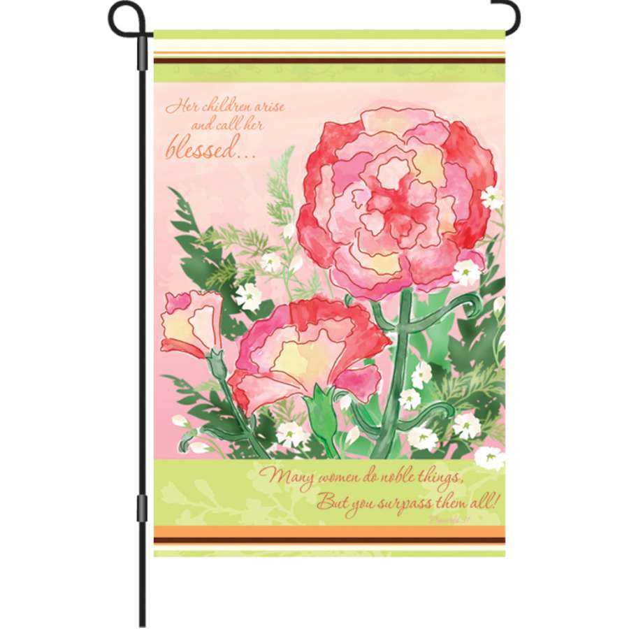 12 in Flag for Mom featuring a heartfelt message, illuminated with vibrant colors, displayed prominently in a garden setting.