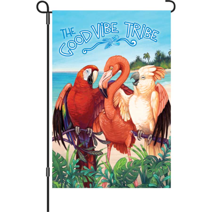 12 in. Good Vibe Tribe flag with vibrant colors and uplifting message displayed in an outdoor garden setting, swaying in the wind.