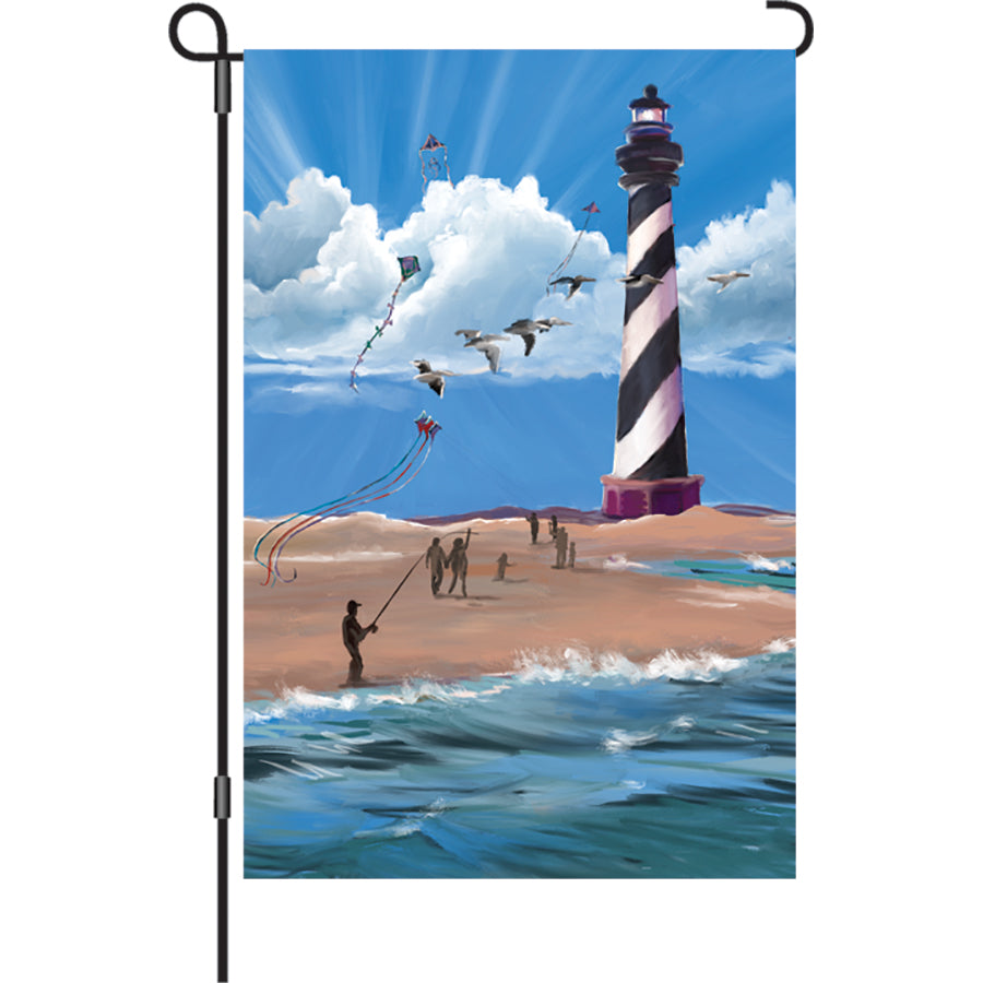 Hatteras Breezy Day garden flag with vibrant summer designs displayed outdoors, enhancing the garden ambiance with eye-catching colors.