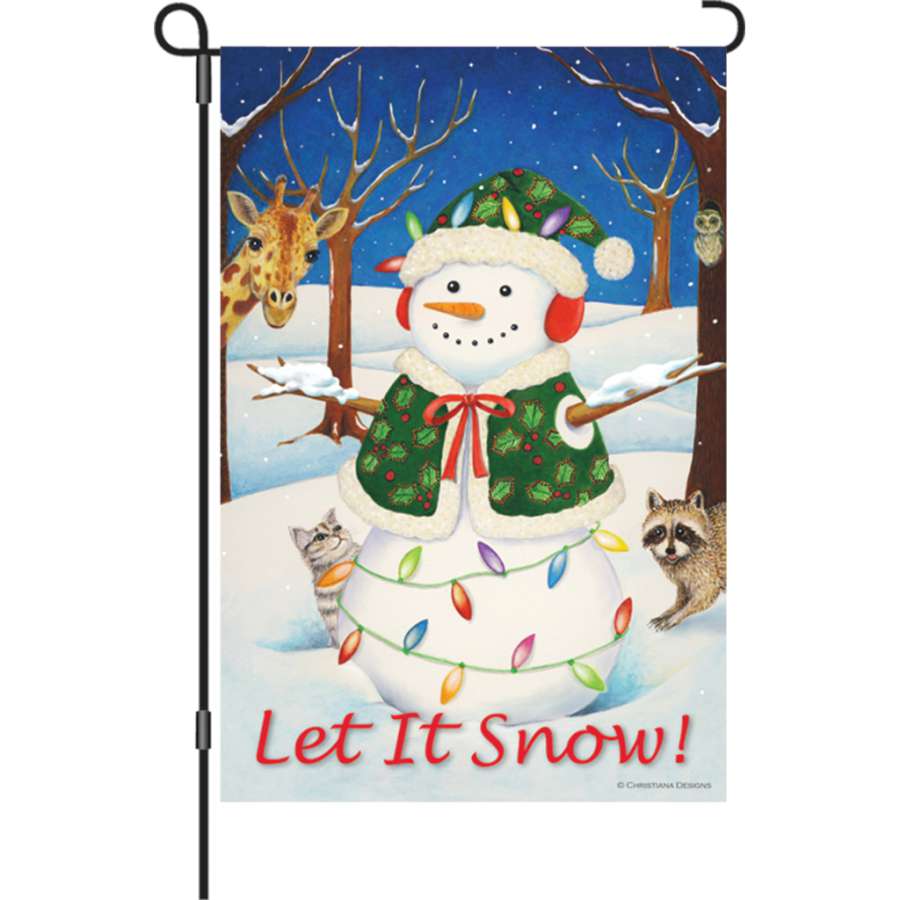12 in. Flag - Hey Here's Snow! features a vibrant 'Let It Snow!' design on soft fabric, displayed on a flag stand in a winter garden setting.