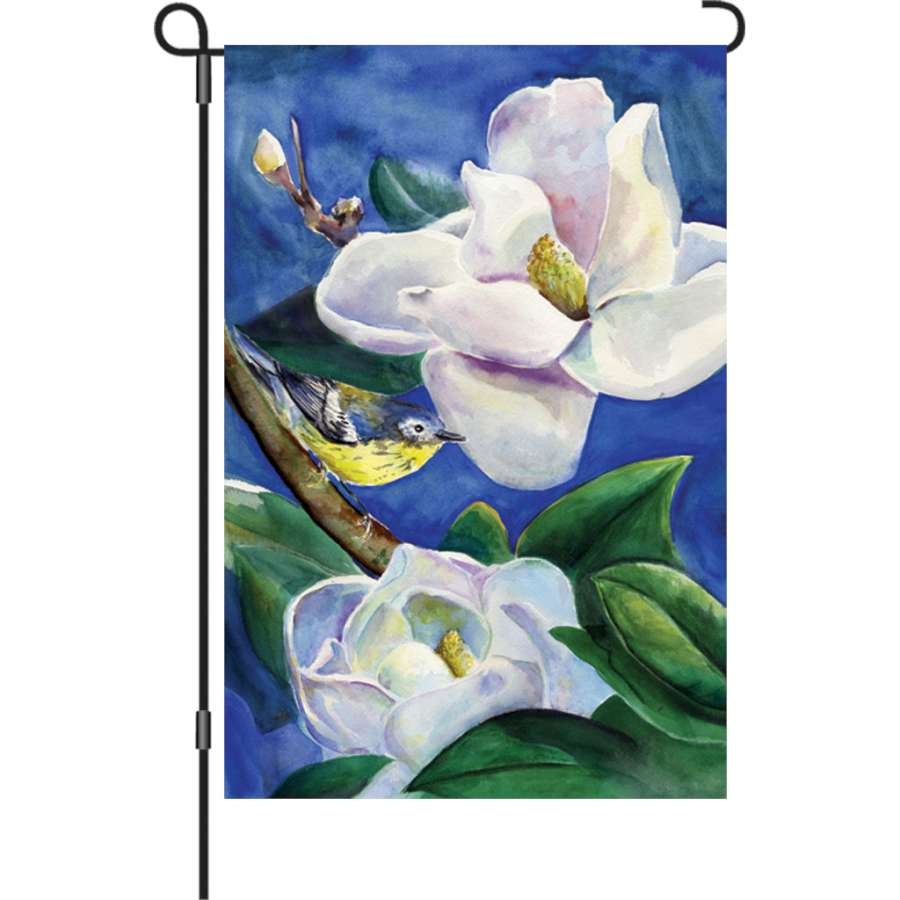 Illuminated 12 in. garden flag featuring a vibrant Magnolia Warbler design, displayed outdoors in a scenic garden setting.
