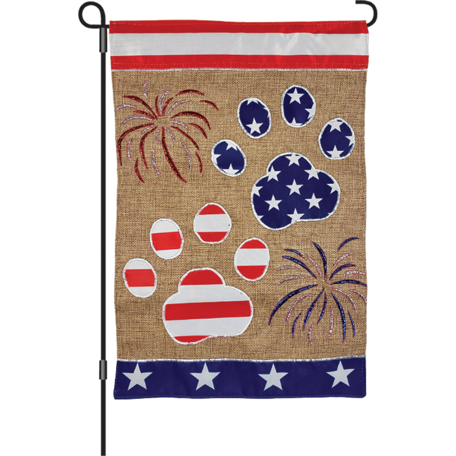 12 in. garden flag featuring adorable dogs in patriotic designs, displayed in a garden setting, showcasing vibrant colors and intricate embroidery.