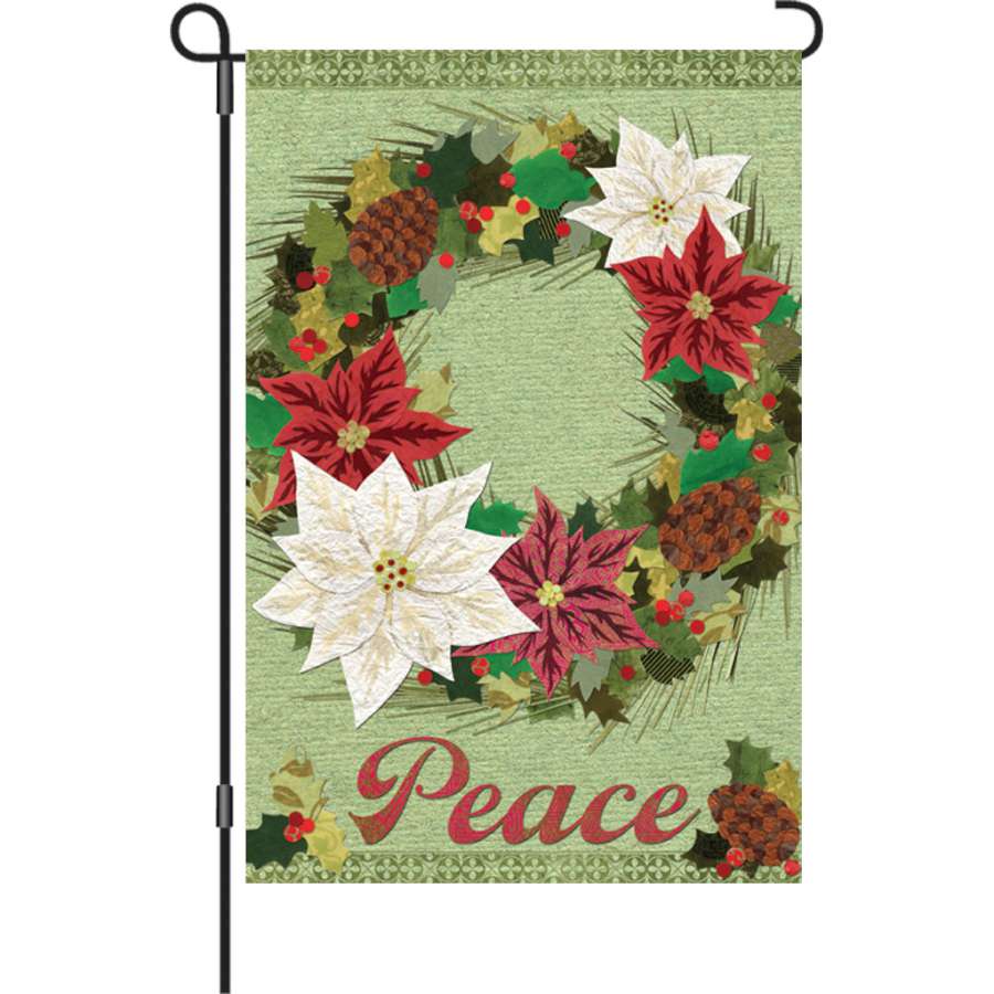 12 in. Poinsettia Wreath garden flag featuring vibrant colors and a soft texture, displayed outdoors with a snowy backdrop.