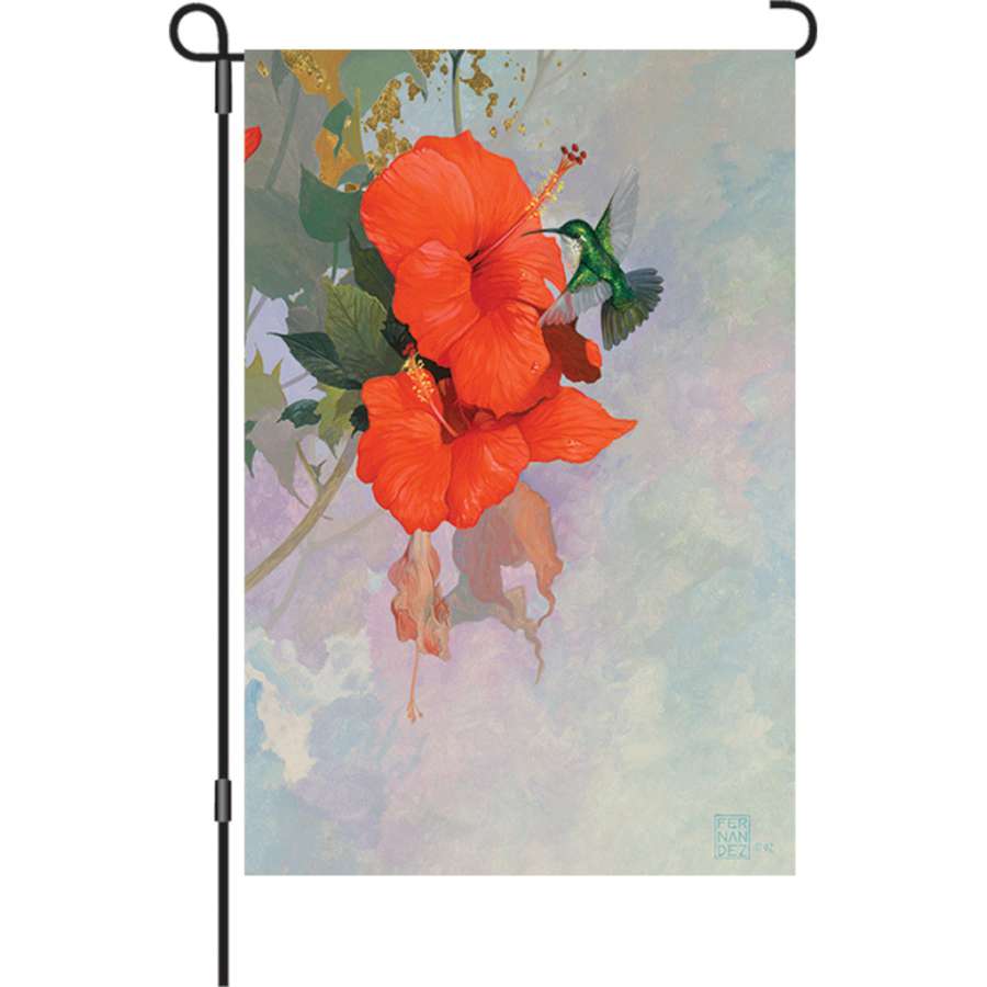 12 in. Red Hibiscus Hummingbird garden flag displaying bright colors and detailed design in a sunny outdoor setting, ideal for garden decor.
