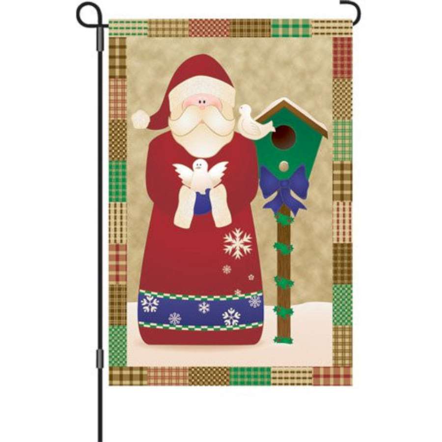 12 in. Flag - Santa's Doves featuring festive doves in Santa hats and scarves, displayed in a garden setting with winter decor.