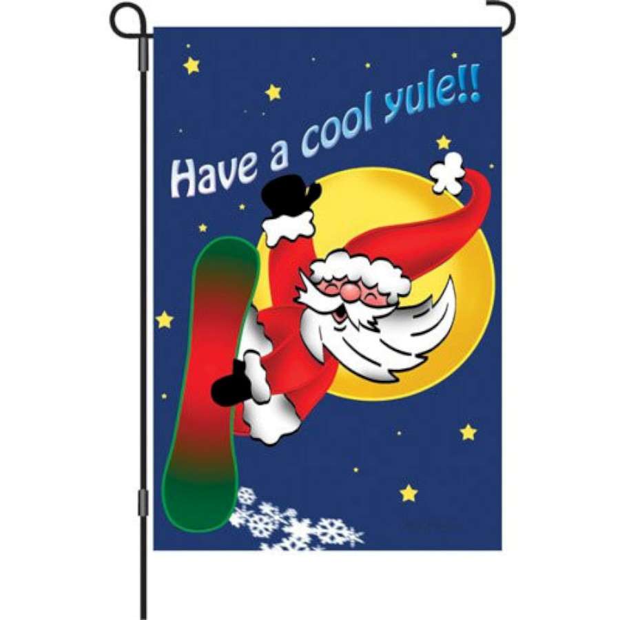 12 inch garden flag featuring a vibrant Snowboarding Santa design, displayed outdoors to celebrate winter holidays with festive cheer.