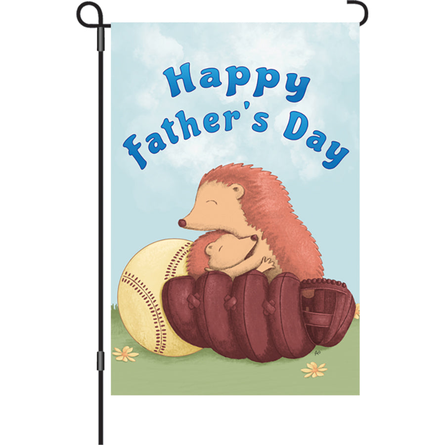 12 in. Hedgehugs garden flag featuring a cute hedgehog design with 'Happy Father's Day' text displayed outdoors, swaying gently in the wind.