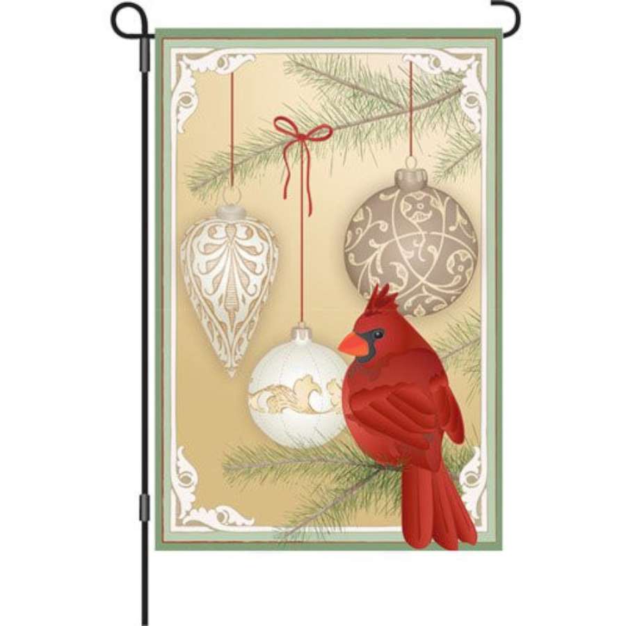 12 in. Holiday Classic garden flag featuring festive winter design displayed on a pole in an outdoor garden setting.