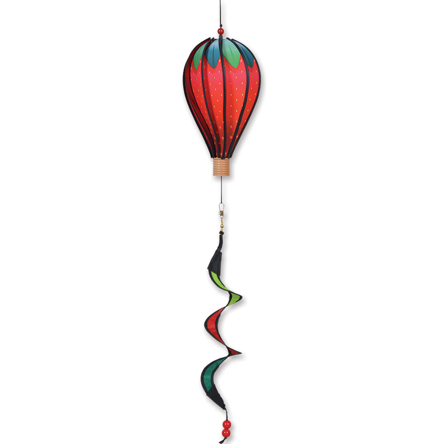 12 in. Hot Air Balloon - Giant Strawberry hanging outdoors, spinning gently in the breeze with its vibrant, colorful design capturing attention.