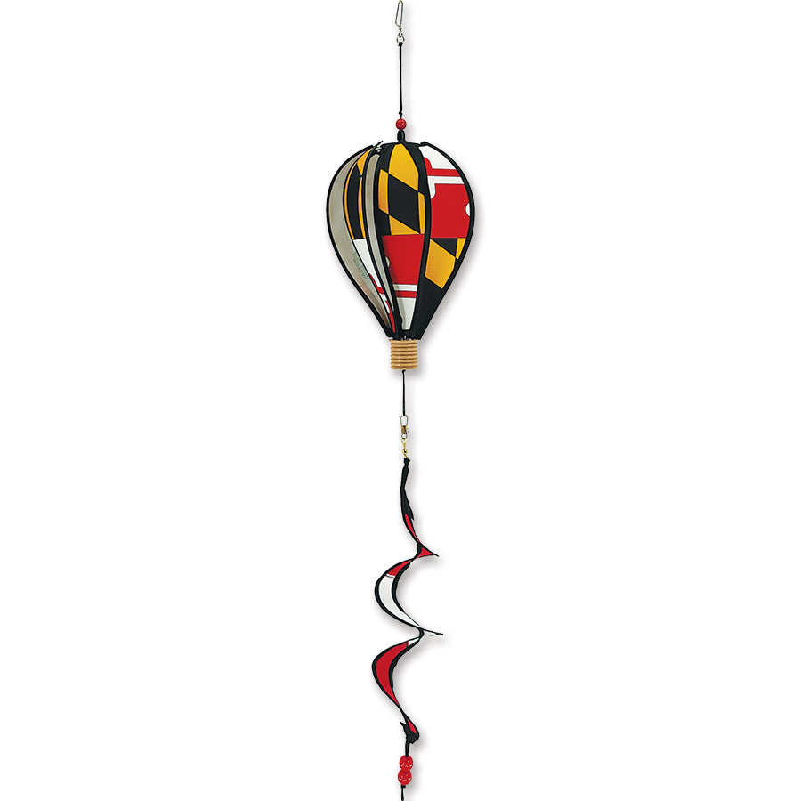 12 in. Hot Air Balloon showcasing the Maryland Flag design, spinning gently in a garden setting, adding vibrant colors to the landscape.