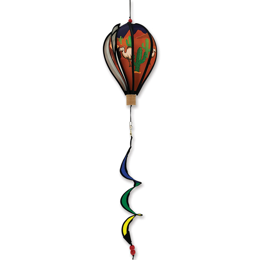 12 in. spinning hot air balloon in Quartzsite Camel design set against a colorful garden backdrop, illustrating its vibrant and whimsical detail.