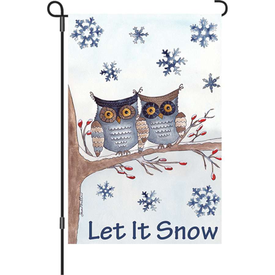 12 in. Owls in the Snow garden flag featuring cute owls and snowflakes, displayed outdoors in a winter setting.