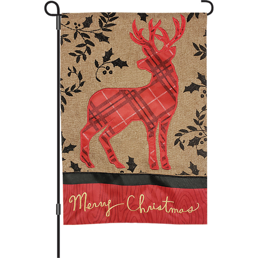 12 in. Rustic Holiday Deer garden flag featuring red deer in plaid and holly, displayed outdoors with a festive Christmas theme.