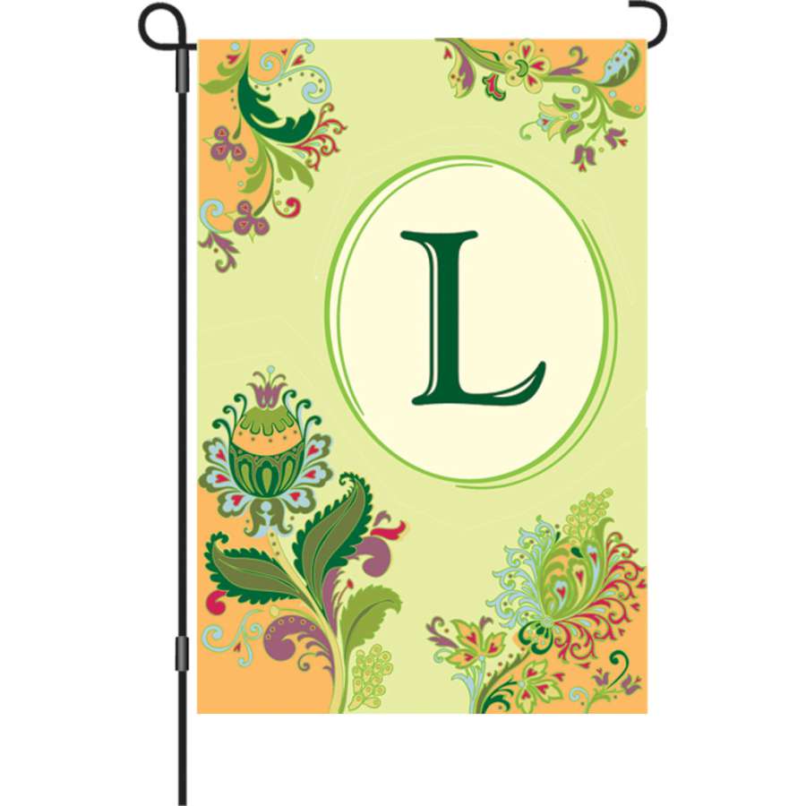 12 in. Spring Monogram Flag - L displayed in a garden, featuring vibrant colors and a stylish monogram design.