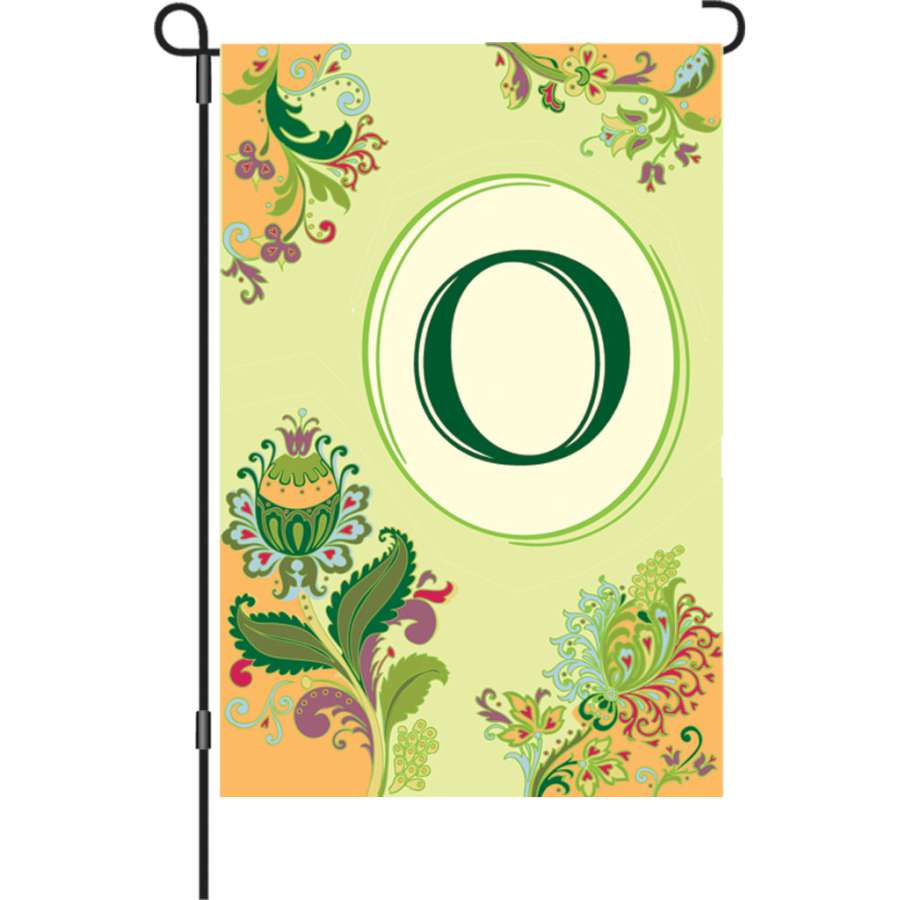 Vibrant 12 in. Spring Monogram Flag displaying an 'O' monogram in a garden setting, designed to add personalized charm to outdoor spaces.