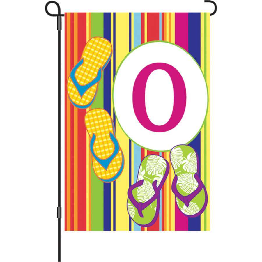 12 in. Summer Monogram Flag - O featuring an intricately designed letter O, displayed in a garden setting with vibrant colors.