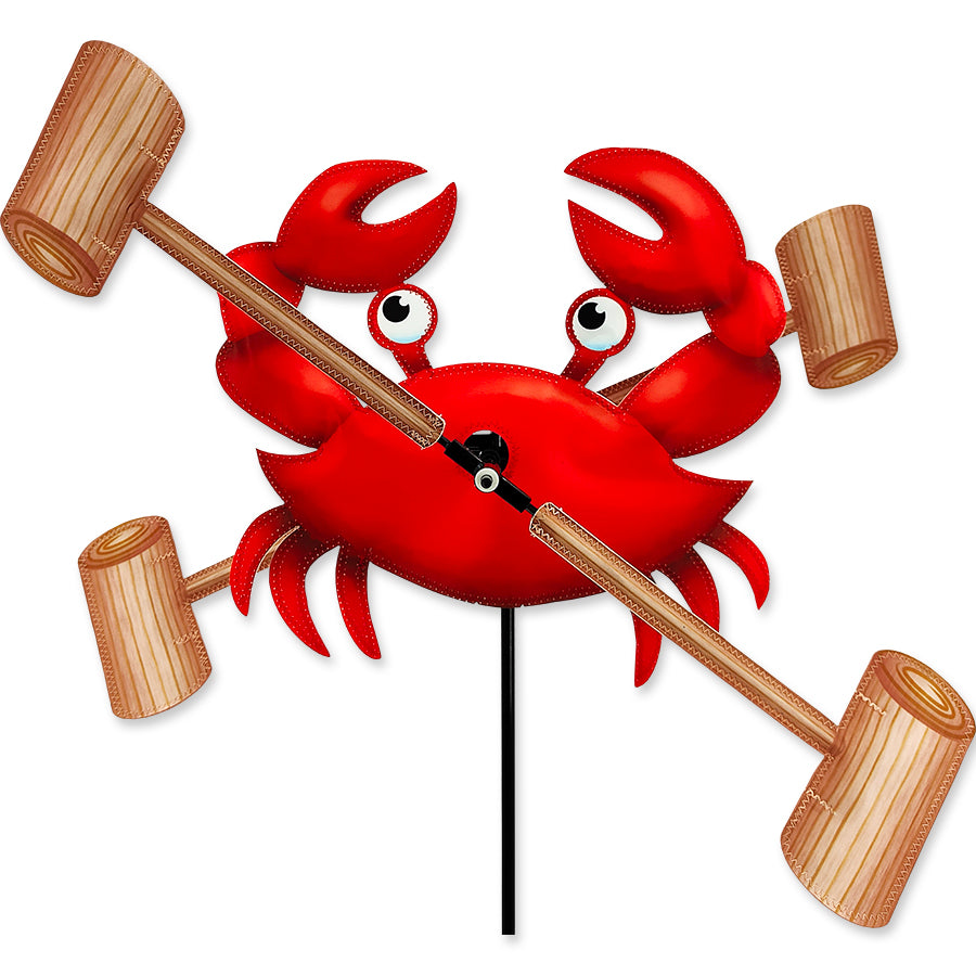 Colorful 12 in. WhirliGig Spinner with a crab design gently spinning in a garden, showcasing vibrant colors against a natural backdrop.